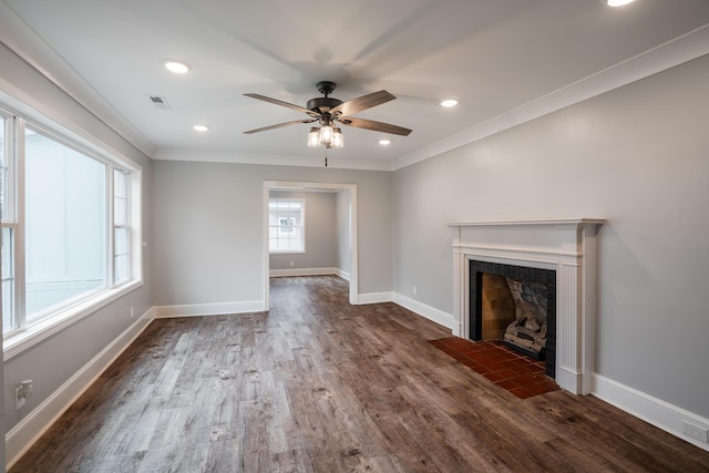 unfurnished living room with ornamental molding, ceiling fan, and dark wood-type flooring