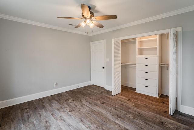 unfurnished bedroom featuring ceiling fan, a closet, dark wood-type flooring, and ornamental molding