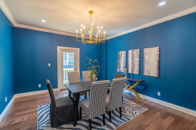 dining area featuring ornamental molding, dark hardwood / wood-style floors, and a notable chandelier