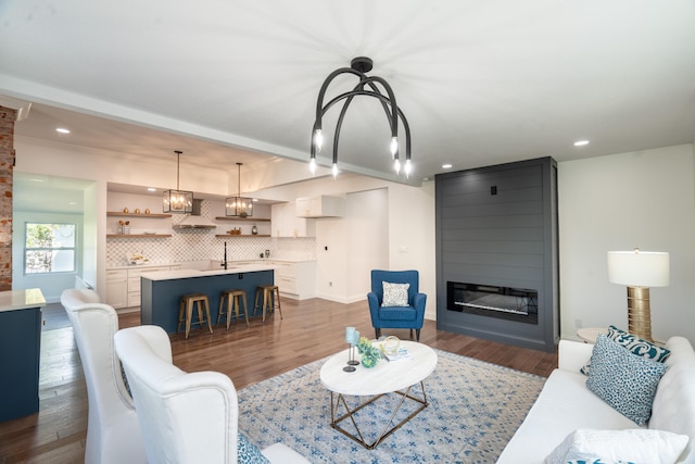 living room with dark hardwood / wood-style flooring and a fireplace