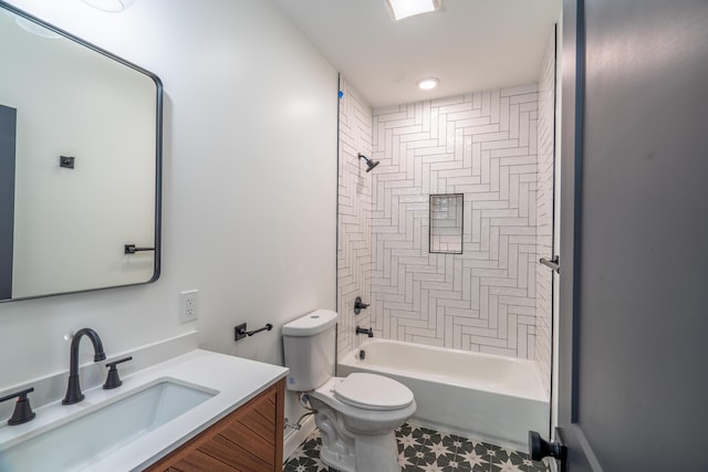 full bathroom featuring toilet, vanity, and tiled shower / bath