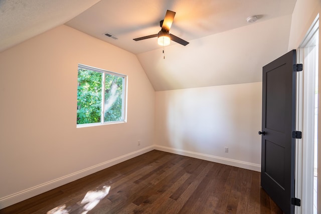 bonus room featuring dark hardwood / wood-style flooring, vaulted ceiling, and ceiling fan