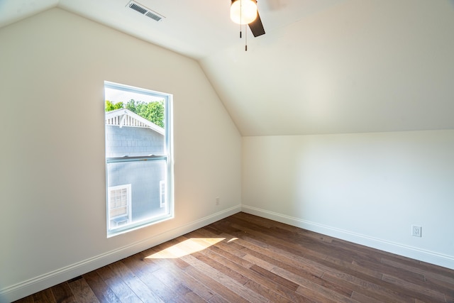 additional living space featuring ceiling fan, wood-type flooring, and vaulted ceiling