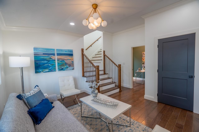 living room with crown molding, dark wood-type flooring, and a notable chandelier