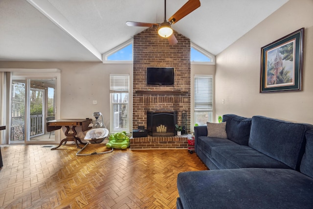 living room with ceiling fan, parquet floors, a healthy amount of sunlight, and a brick fireplace