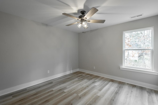 spare room with light hardwood / wood-style floors and ceiling fan