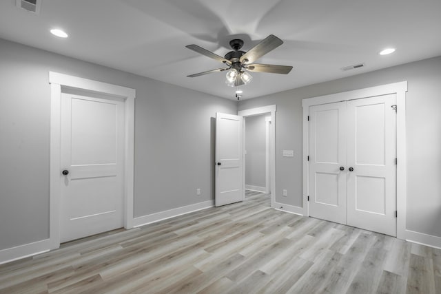 unfurnished bedroom featuring a closet, ceiling fan, and light hardwood / wood-style flooring