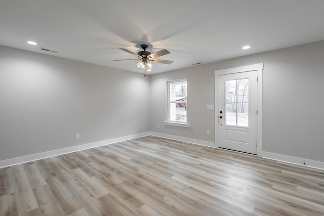 entryway with ceiling fan and light hardwood / wood-style floors