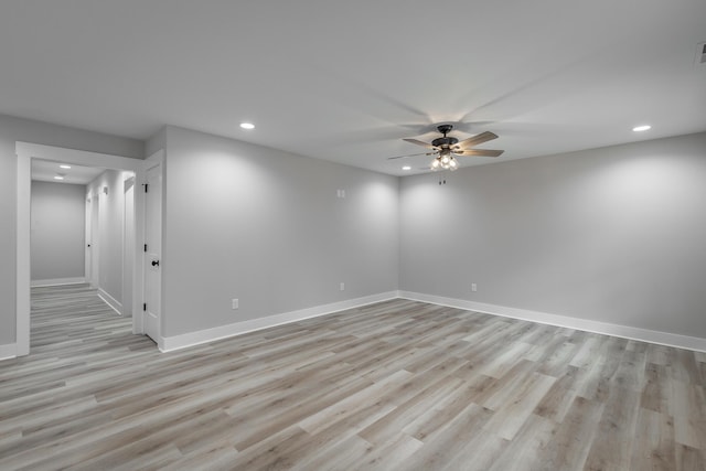 unfurnished room with ceiling fan and light wood-type flooring