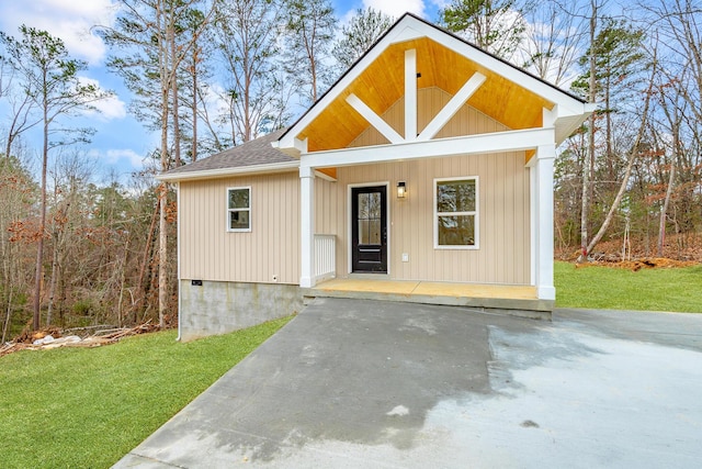 view of outbuilding featuring a yard