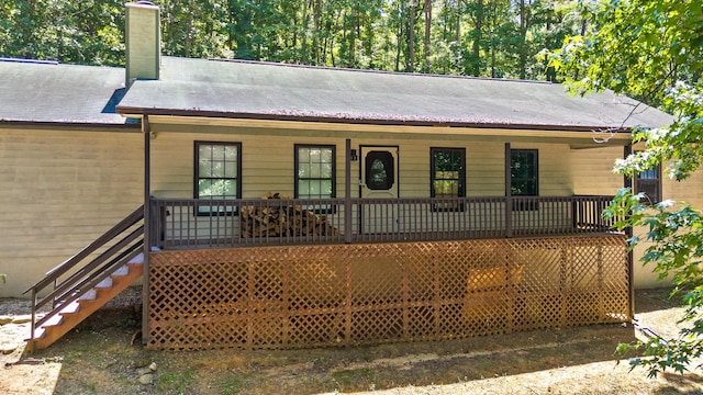 ranch-style home featuring covered porch