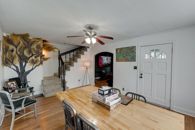 entryway with wood-type flooring and ceiling fan