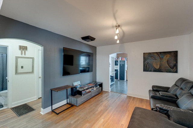 living room with light hardwood / wood-style floors