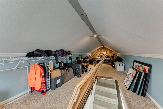 additional living space featuring carpet flooring, a textured ceiling, and lofted ceiling