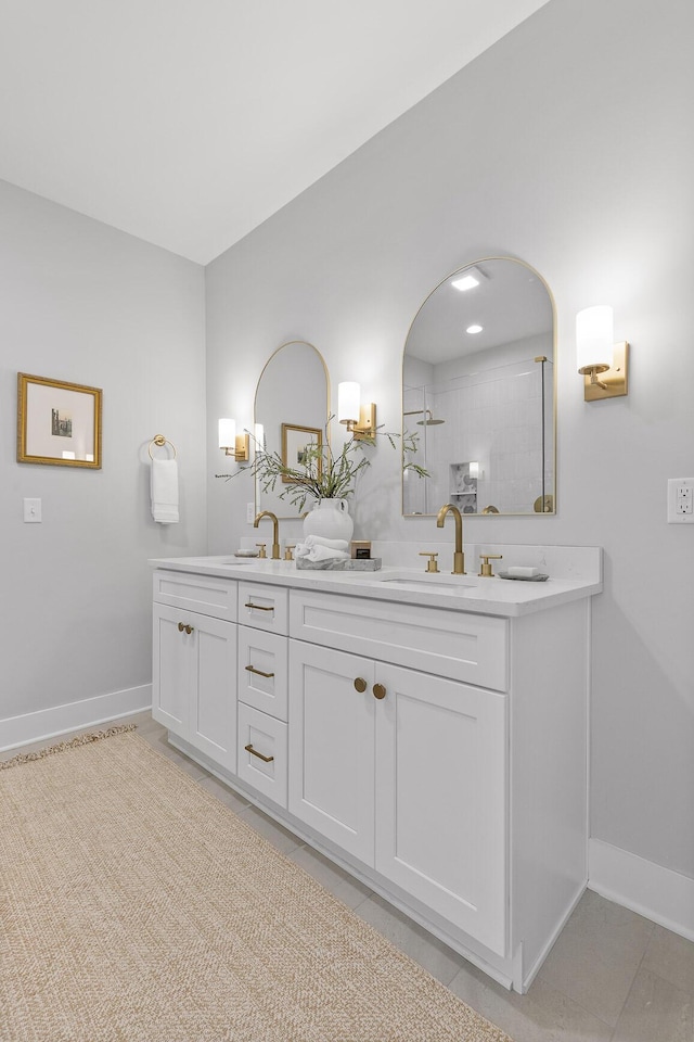 bathroom with tile patterned flooring and vanity