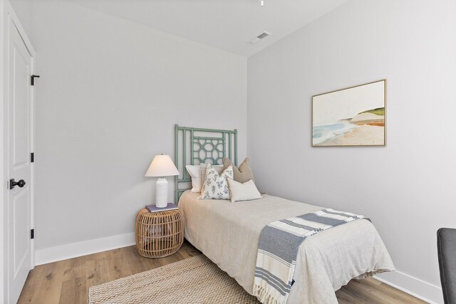 bedroom featuring hardwood / wood-style flooring