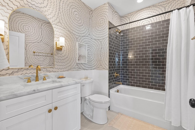 full bathroom with tile patterned floors, vanity, toilet, and shower / bath combo with shower curtain