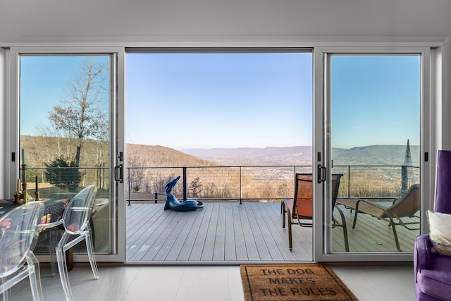 entryway featuring a mountain view and tile patterned floors