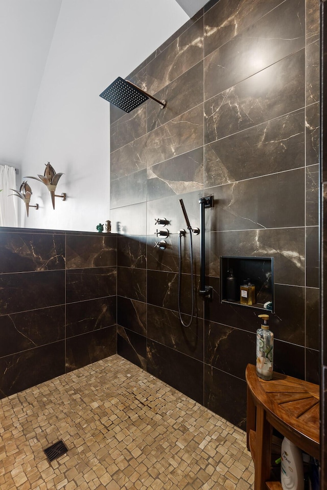 bathroom with tiled shower