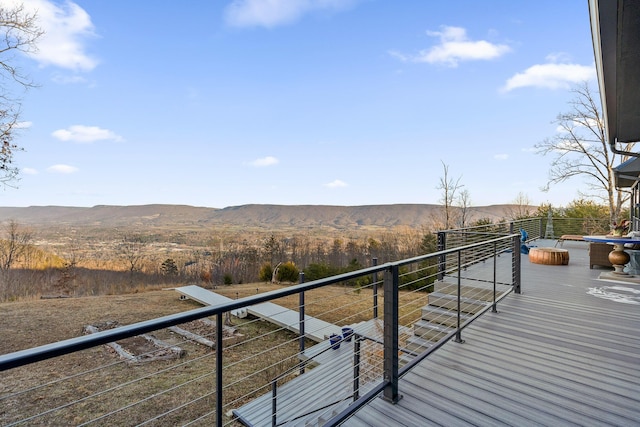 wooden terrace with a mountain view