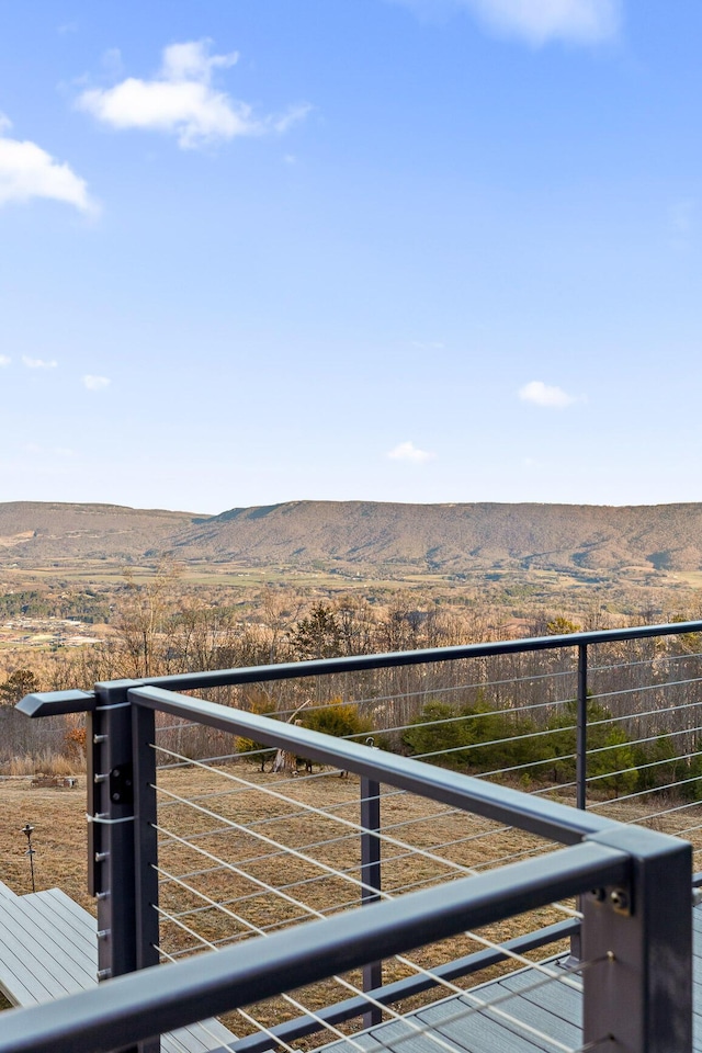 balcony featuring a mountain view