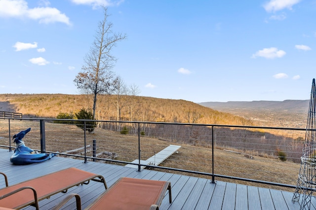 wooden deck with a mountain view