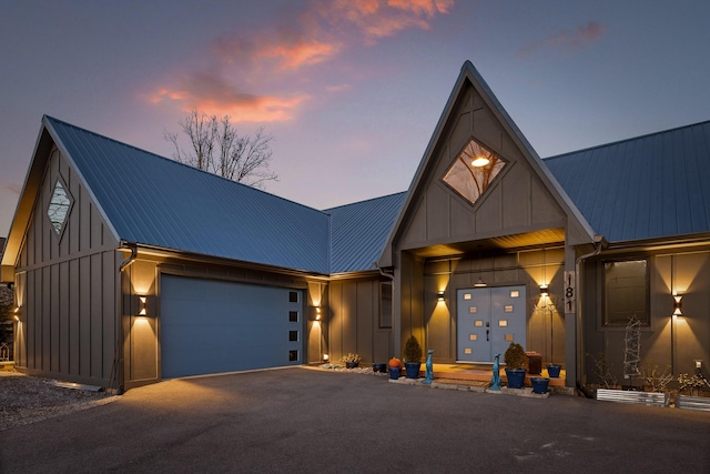 modern farmhouse featuring a garage