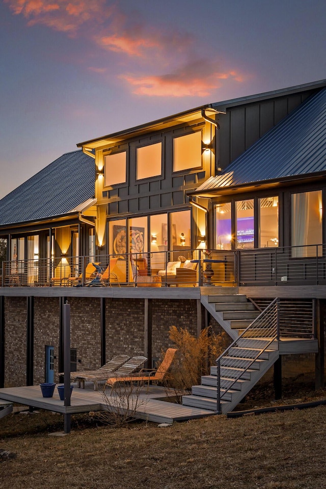 back house at dusk with a patio and an outdoor hangout area