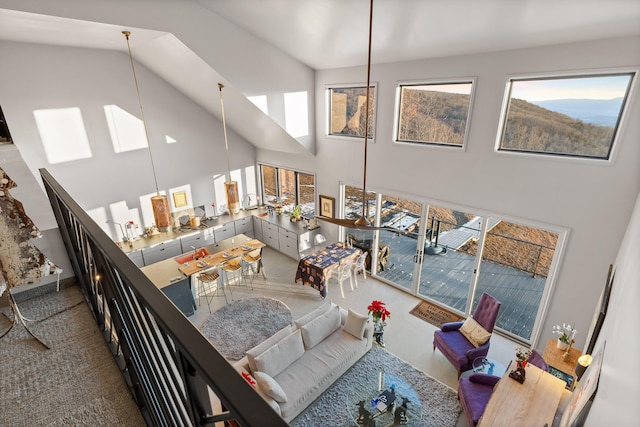 living room with a towering ceiling