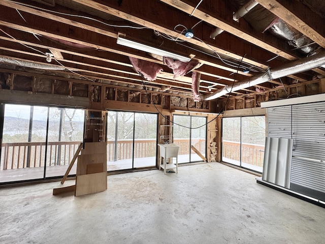 miscellaneous room with sink and concrete floors