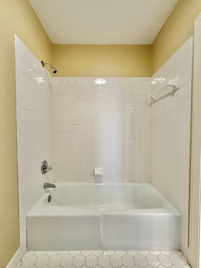 bathroom featuring tile patterned floors and washtub / shower combination