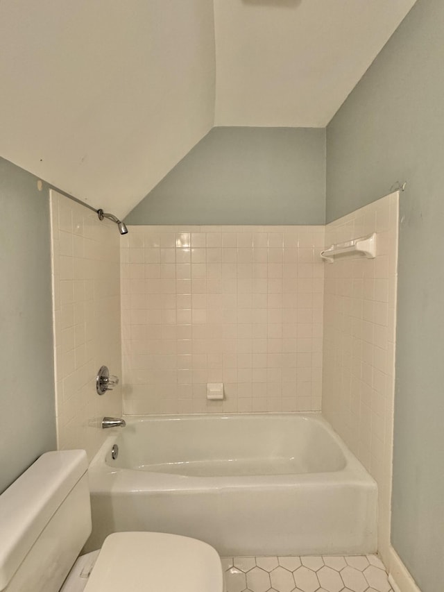 bathroom featuring tile patterned floors,  shower combination, and toilet