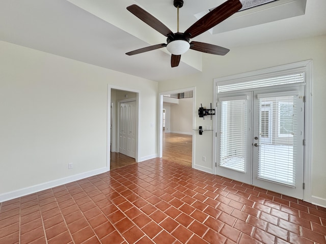 unfurnished room with tile patterned flooring, french doors, and ceiling fan