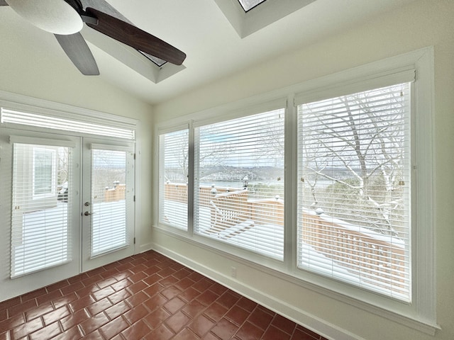 unfurnished sunroom featuring french doors, vaulted ceiling, and ceiling fan