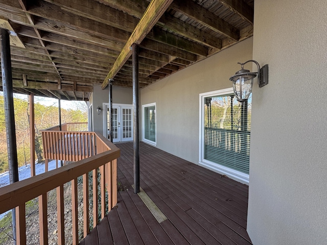 wooden deck featuring french doors