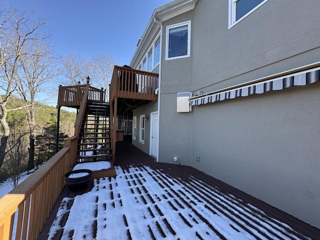 view of snow covered deck