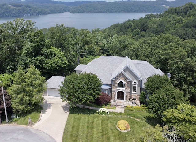 5703 Laurel Ridge Rd, Chattanooga, TN 37416 - view of front facade featuring stone siding, a view of trees, a water view, a front yard, and stucco siding