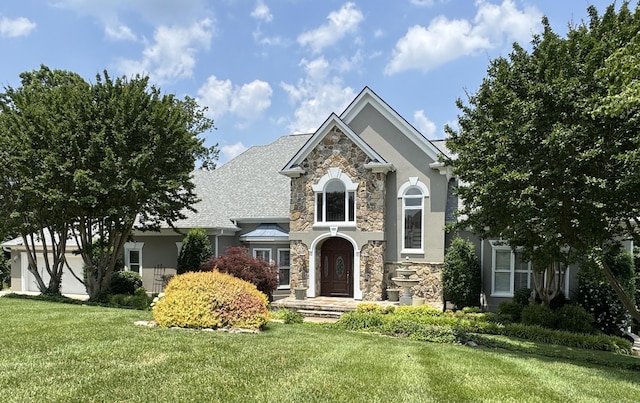 5703 Laurel Ridge Rd, Chattanooga, TN 37416 - view of front of property featuring stone siding, a front yard, and stucco siding
