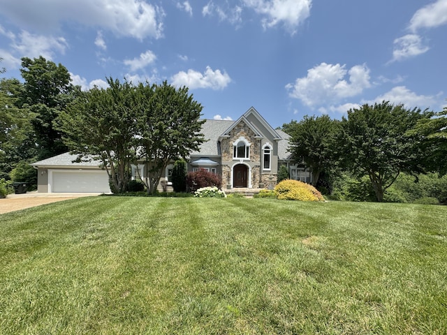 5703 Laurel Ridge Rd, Chattanooga, TN 37416 - view of front of house featuring stone siding, a garage, concrete driveway, and a front lawn