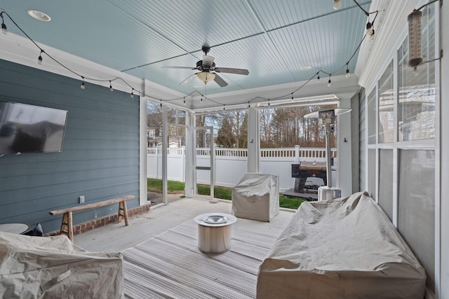 sunroom / solarium with ceiling fan