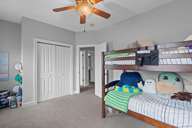 bedroom featuring ceiling fan, a closet, and carpet floors