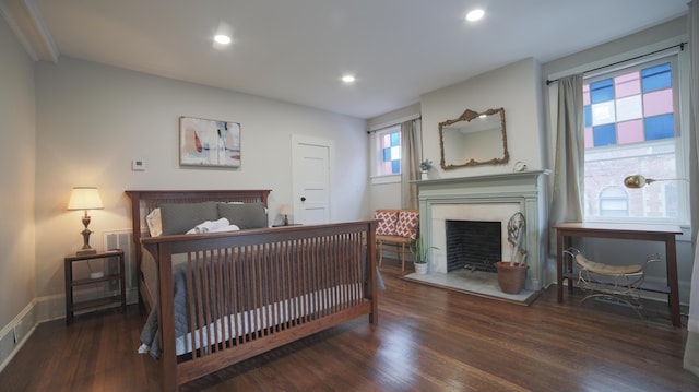 bedroom featuring dark hardwood / wood-style flooring