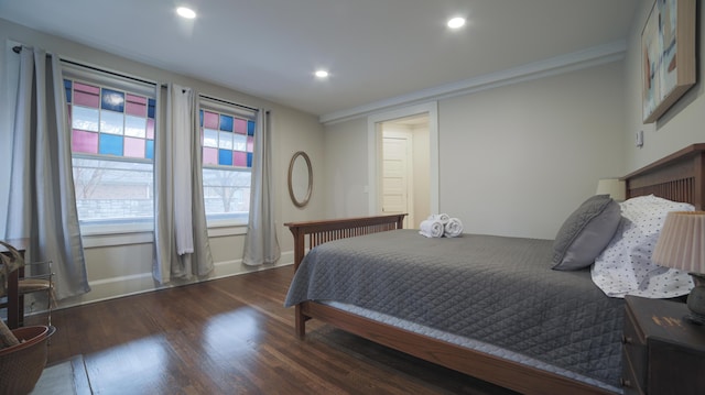 bedroom with dark hardwood / wood-style flooring