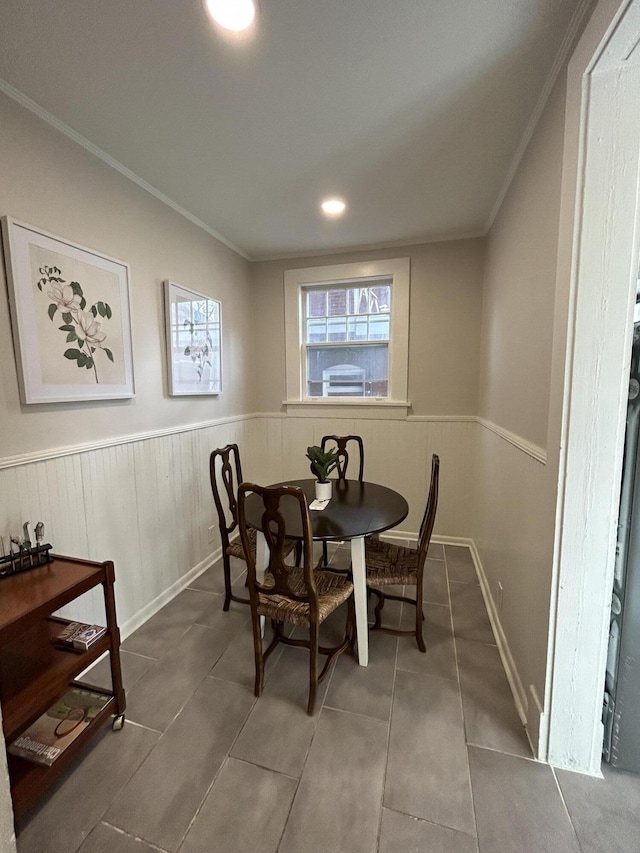 tiled dining area with ornamental molding