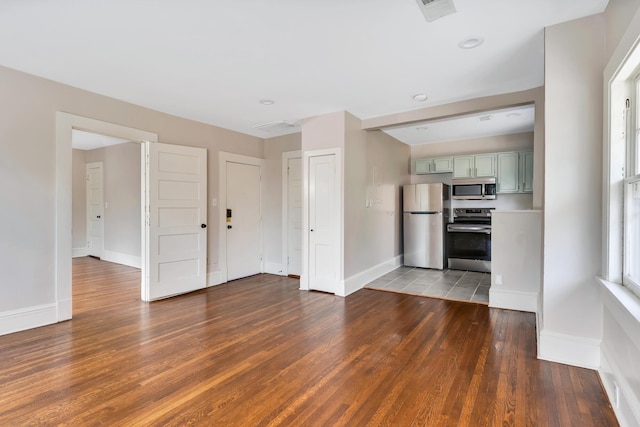 unfurnished living room featuring dark hardwood / wood-style flooring