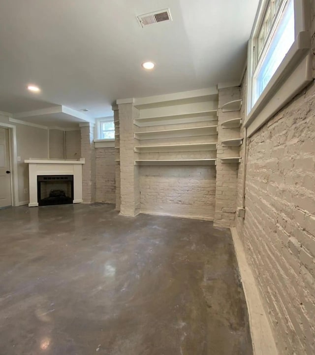 basement with brick wall