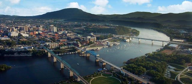 drone / aerial view with a water and mountain view