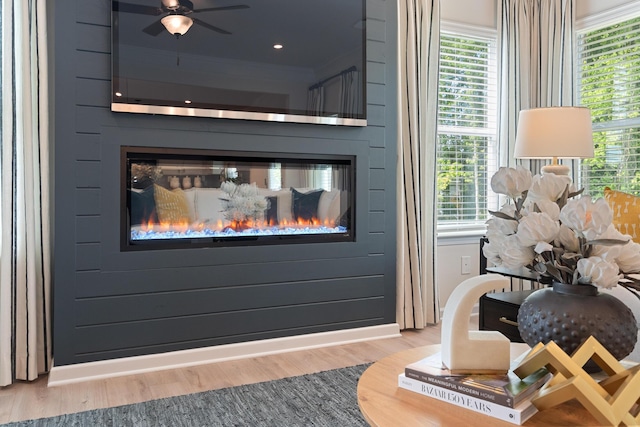 interior space with a large fireplace and hardwood / wood-style flooring