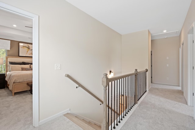 staircase featuring carpet flooring