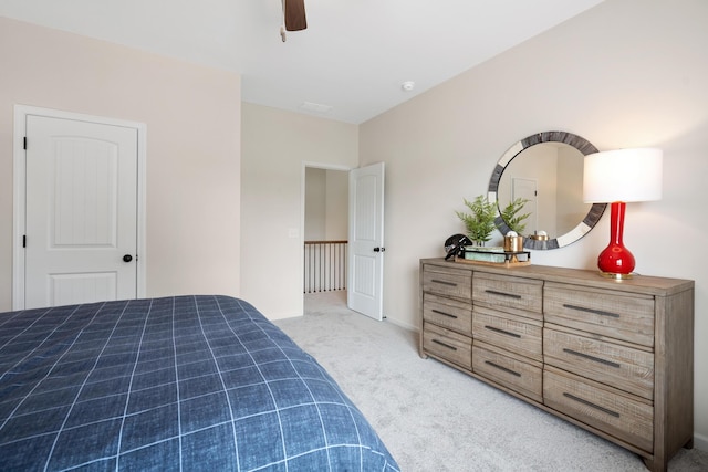 carpeted bedroom with ceiling fan